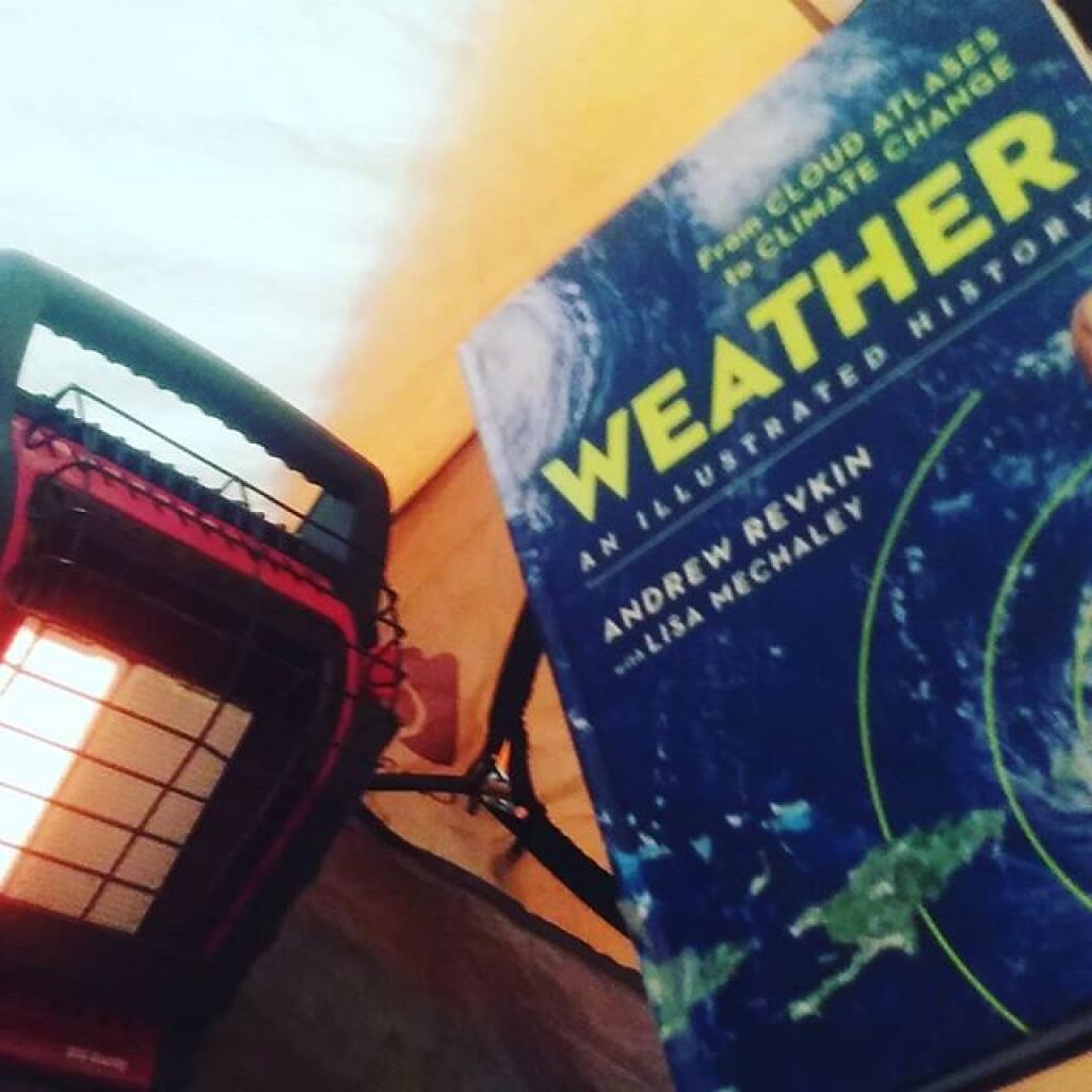 Photo: Might be cold and wet outside but it's hot in here with a good book Photo: Might be cold and wet outside but it's hot in here with a good book
