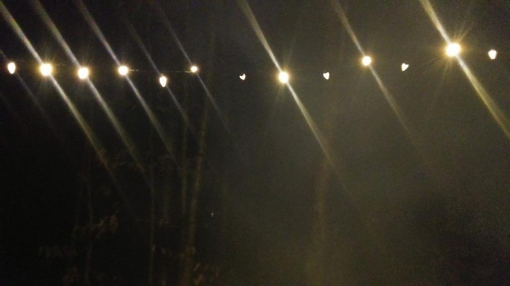 Photo: Smoke filters past the lights